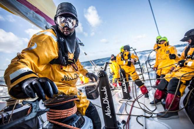 Onboard Abu Dhabi Ocean Racing - Daryl Wislang cleans up the pit after a sail change in wet conditions that require eye protection to see - Leg five to Itajai -  Volvo Ocean Race 2015 © Matt Knighton/Abu Dhabi Ocean Racing